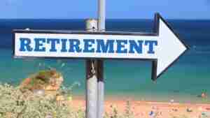 retirement-plan-arrow-sign-beach-1068x713