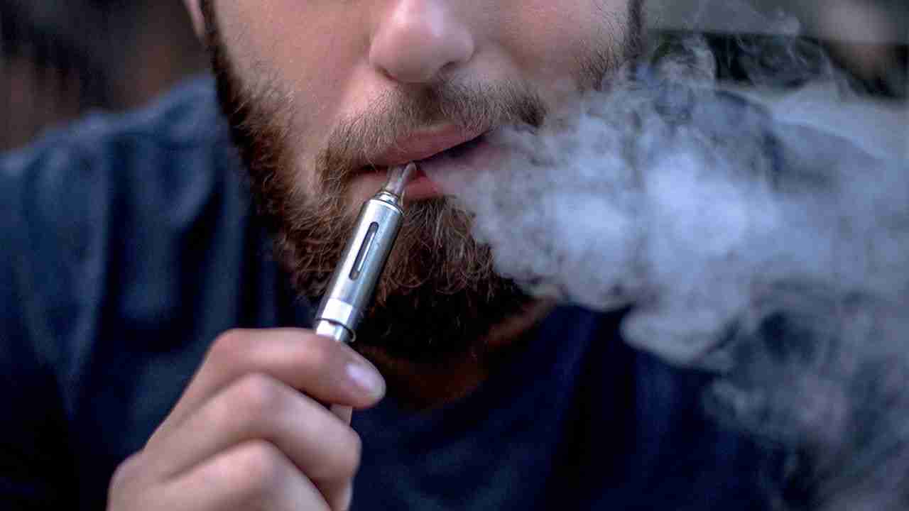 Man Exhaling Vapour from E-Cigarette