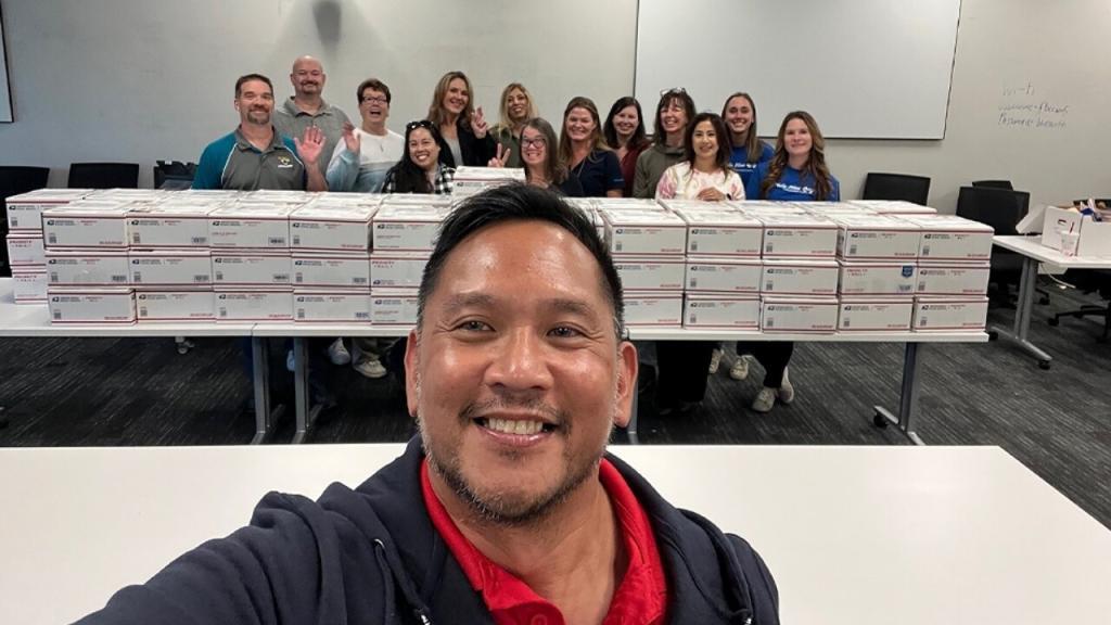 USPS employees prepare care packages for military members overseas