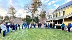 ‘He’s experienced our lives with us’: neighbors celebrate retiring letter carrier