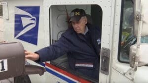 ‘It’s amazing’: 90-year-old mail carrier recognized for nearly 65 years at USPS