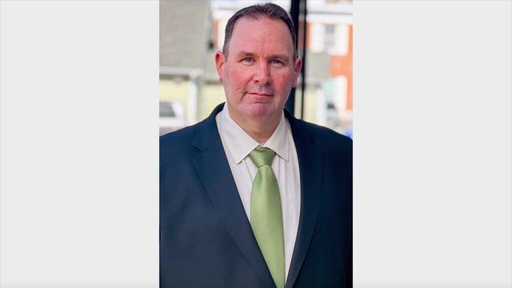 This postmaster coaches athletes with disabilities