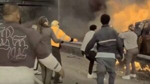 Dramatic dashcam video shows good Samaritans, including a postal worker, rush to pull man from burning car