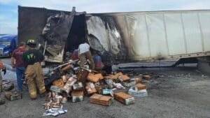 Several firefighters suffer from heat exhaustion fighting USPS semi-truck fire