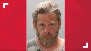 KPD: Man arrested after burning clothes, flag outside of post office