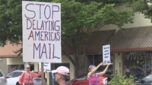 Local postal workers to rally for return of postmark machine