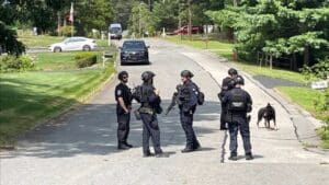 Search ongoing for man accused of pointing gun at mail carrier, ditching car in Tewksbury