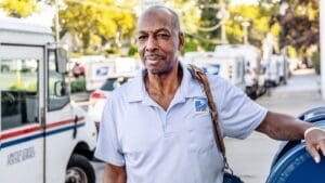 Manhasset Letter Carrier Eugene Leader honored for 34 years of service to USPS and community