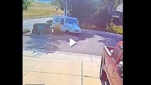 USPS Worker Takes a Tumble Out of His Mail Truck As It Crashes