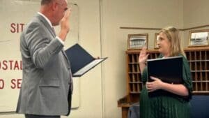 Father administers oath to daughter as new Vega Postmaster