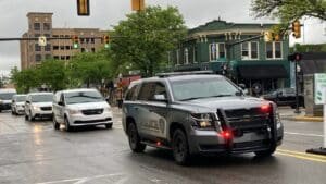 Mail carrier honored with police, postal van procession along Oakland County route