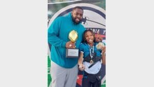 This USPS employee uses football to develop young men of character