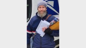 This letter carrier checked out some extra help to find a customer