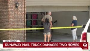 Runaway mail truck damages two properties