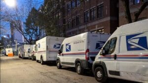 Illegally parked USPS trucks are being blamed after a cyclist was doored