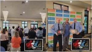 Postal Employee presents First Responder stamp plaques to Firefighters of the year
