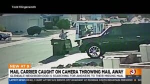 Video shows postal worker dumping mail into trash cans
