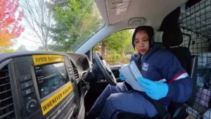 Smiling Saratoga postal carrier delivers mail and holiday cheer