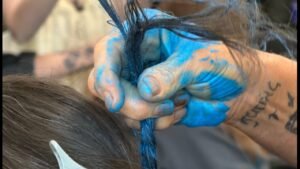 Treasure Valley mail carriers dye hair blue for annual ‘Stamp Out Hunger’ food drive
