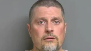 Michigan man accused of threatening, directing racial slurs at mail carrier who asked him to secure dog