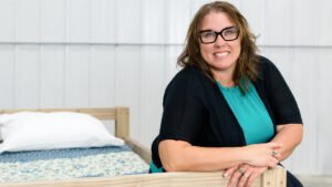 This postal employee volunteers for an organization that builds beds for children in need