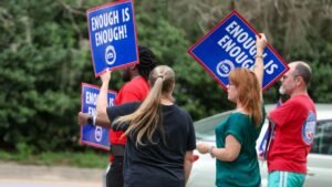 Rural mail carriers rally in Gainesville seeking on-the-job protection